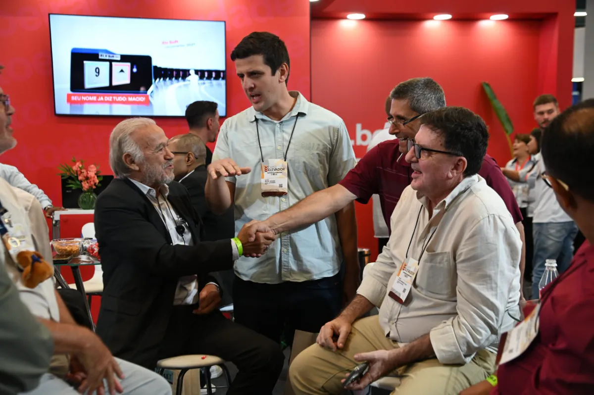 Professionals greeting at a booth